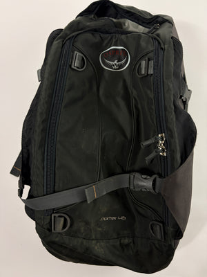 A black Osprey Porter 45 backpack shown against a plain off-white background. The backpack features multiple zippered compartments, a padded shoulder strap, and the Osprey logo patch on the upper front.