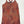 A sleeveless halter-style top with a dense geometric and tribal-inspired pattern in red, orange, brown, and blue, displayed flat against a light gray background.