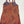 A sleeveless halter-style dress with a dense geometric and tribal-inspired pattern in orange, red, brown, and blue, featuring a solid purple lining visible at the neckline.